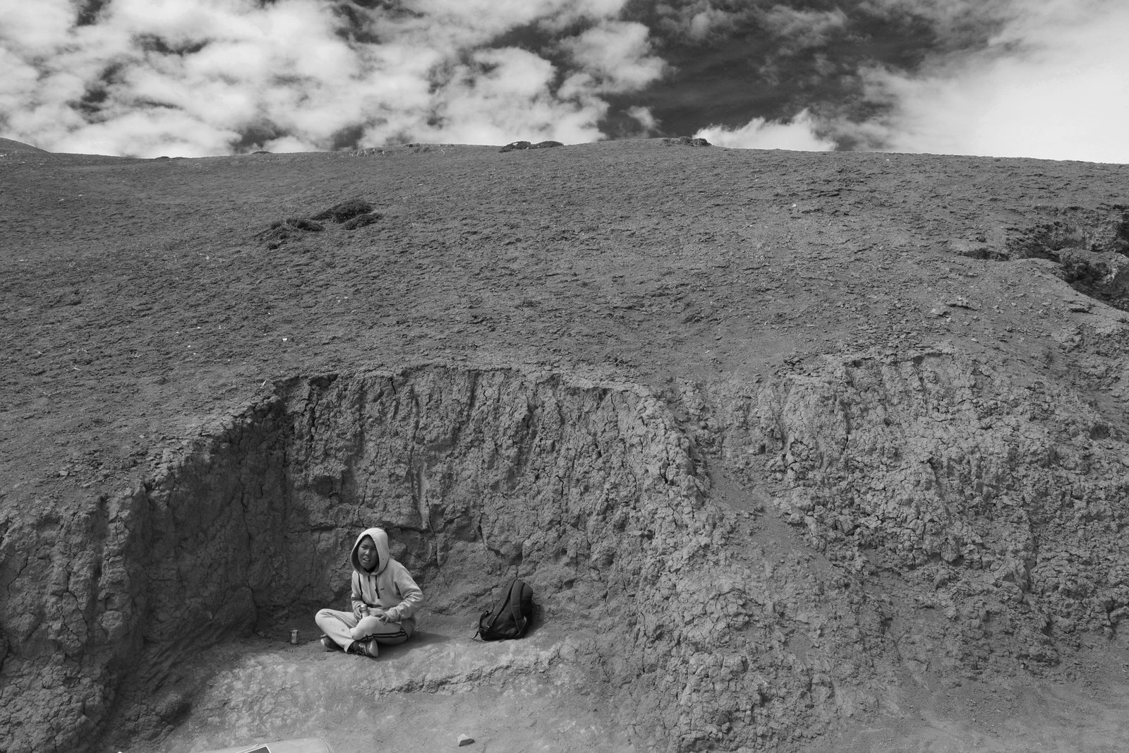 Child sitting on cliff edge.jpg